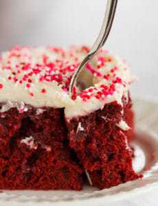 Red velvet cake is infused with sweetened condensed milk and topped with the best cream cheese frosting. A must for Valentine's Day!