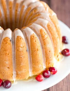 This Cranberry Pound Cake is wonderfully dense, moist and loaded with fresh cranberries. Topped with a simple orange glaze, it's perfect for the holidays.