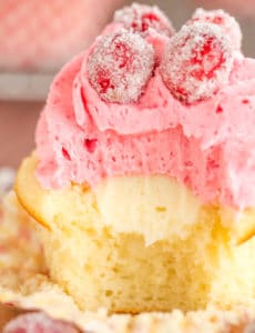 Sparkling Cranberry White Chocolate Cupcakes - Vanilla cupcakes with white chocolate ganache filling and cranberry buttercream frosting. | browneyedbaker.com