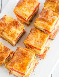 This easy antipasto appetizer bake features layers of Italian meats and cheese, sandwiched between layers of crescent dough. Great for parties!