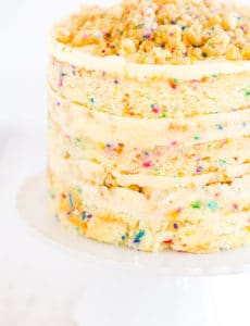 The famous Momofuku Milk Bar Birthday Layer Cake - Layers of funfetti cake loaded with sprinkles, vanilla frosting, and birthday cake crumbs!