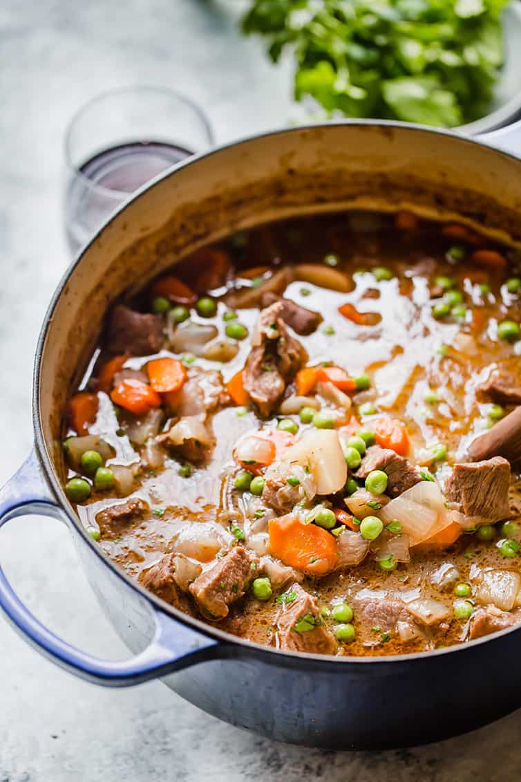 A Dutch oven filled with beef stew.