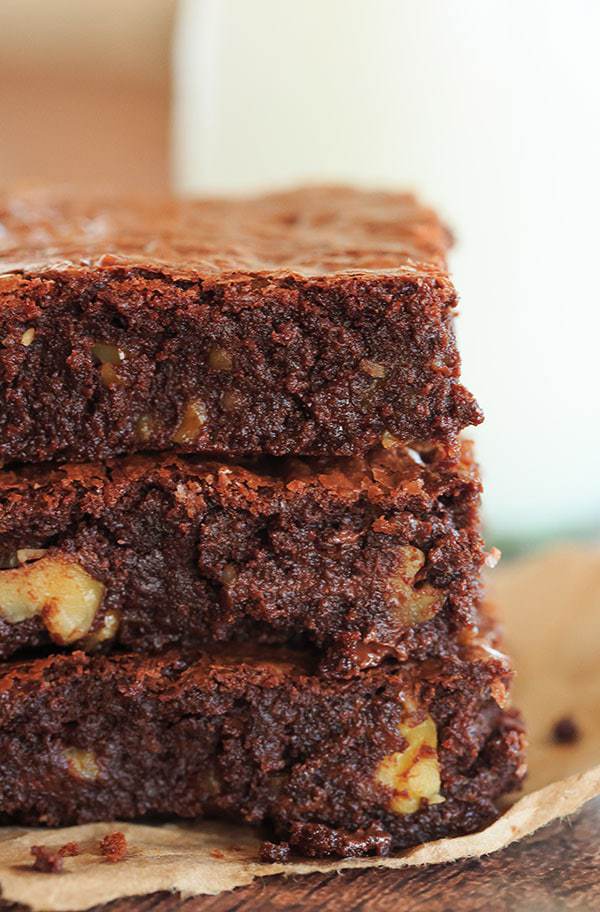 Ina's Outrageous Brownies - The super rich brownie brainchild of Ina Garten, complete with tons of chopped walnuts! | https://www.browneyedbaker.com/outrageous-indeed/