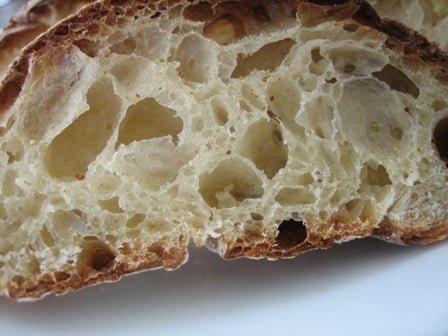 Close up image of a slice of rustic bread.