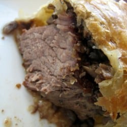 Showing the inside texture of beef Wellington.