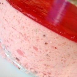 Side view of strawberry mirror cake.