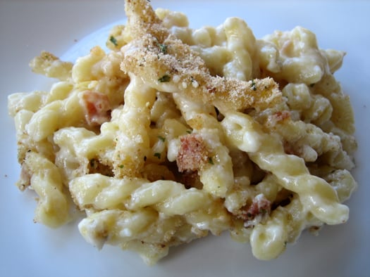 Macaroni and cheese on a white plate.