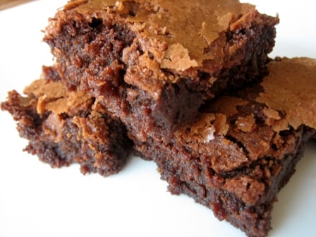 3 chocolate brownies on a white plate.