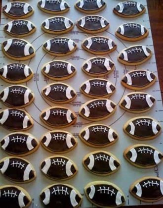 Sugar cookies decorated like footballs.