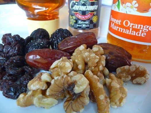 Ingredients for Italian fig cookies including figs, walnuts, orange marmalade, cinnamon, and honey.