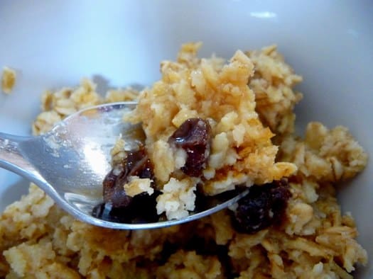 Spoonful of baked oatmeal with raisins.