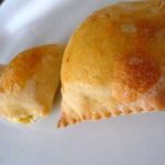 Italian gougeres on a white plate.