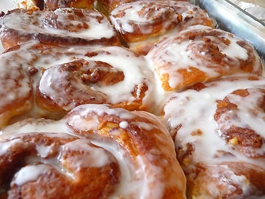 Cream cheese cinnamon rolls in a baking dish.