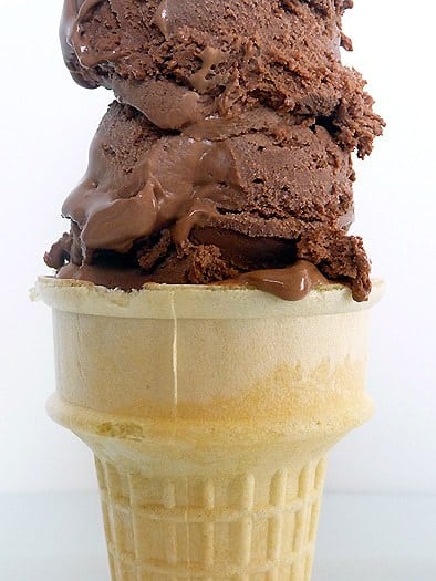 Ice cream cone with 2 scoops of chocolate ice cream.