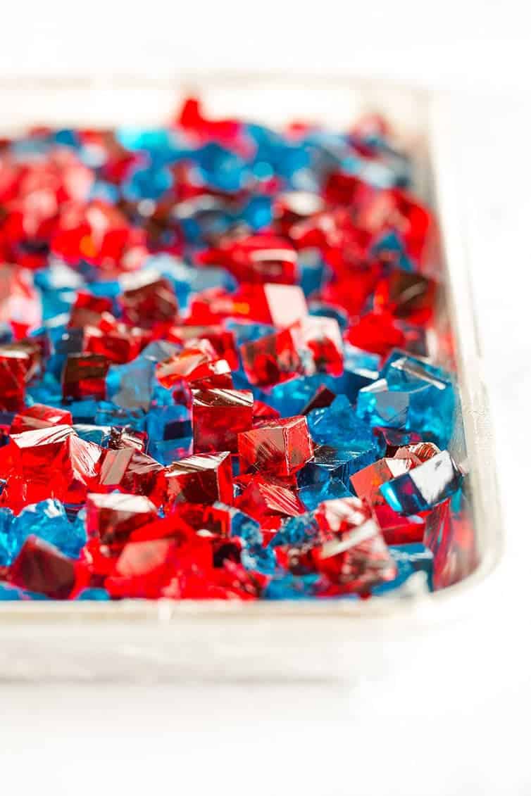 Red and blue Jello cubes are prepped for stained glass Jello stars!