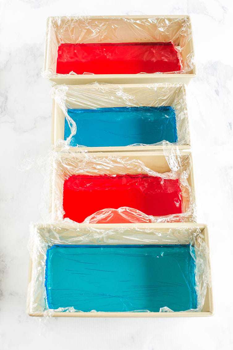 Red and blue Jello prepped in loaf pans for red, white & blue stained glass Jello stars.