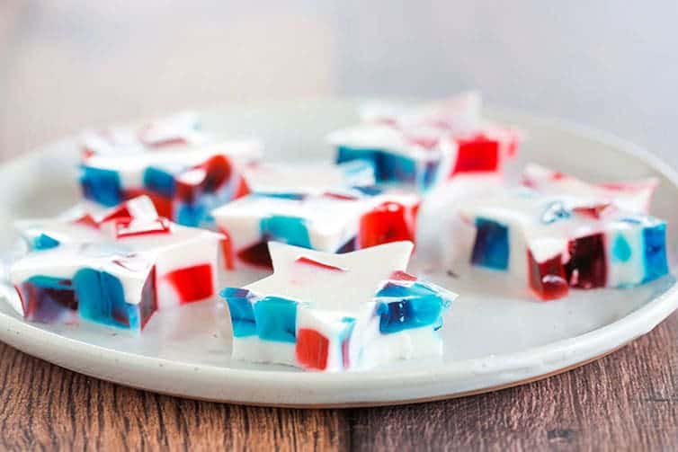 A plate of red, white and blue stained glass Jello stars.
