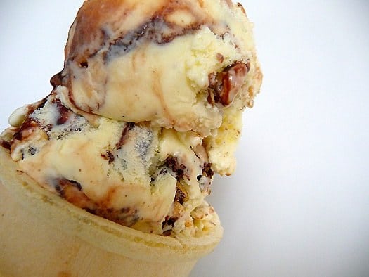 Ice cream cone with 2 scoops of tin roof ice cream.