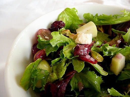 Salad in a white bowl.