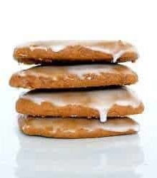 Stack of 4 Lebkuchen cookies on a white plate.