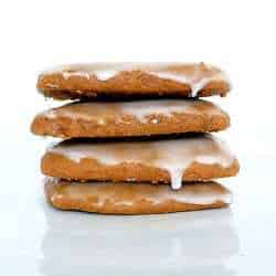 Stack of 4 Lebkuchen cookies on a white plate.