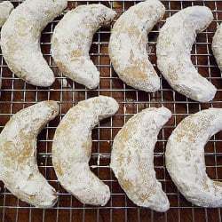 Overhead image of nut crescent cookies on a cooling rack.