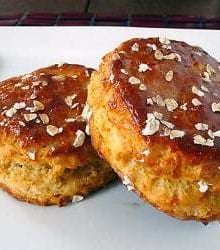 2 maple oatmeal scones on a white plate.
