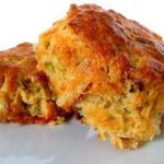 2 quiche lorraine scones on a white plate.