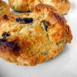 Irish soda bread scone on a white plate.
