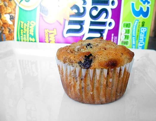 Raisin Bran muffin on a white plate.