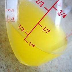 Melted butter in a glass measuring cup.
