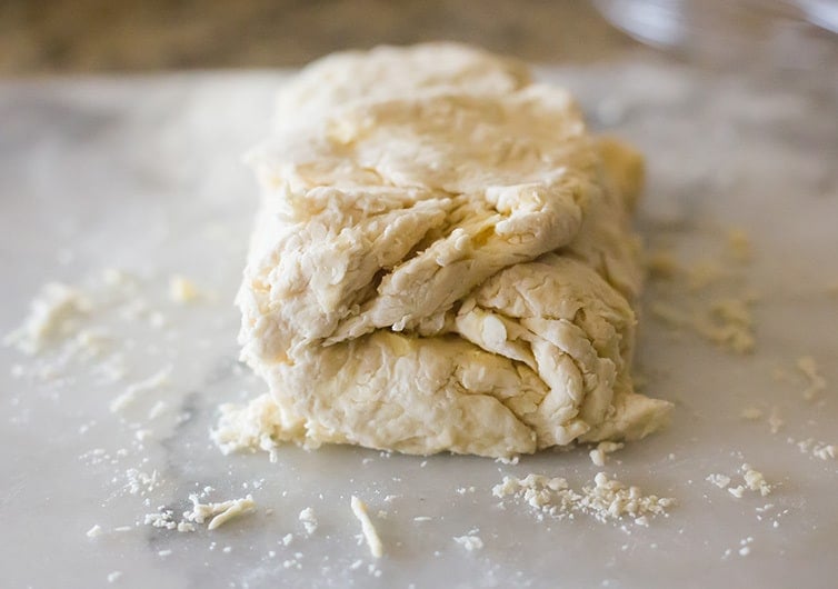 Buttermilk biscuit dough folded into thirds.