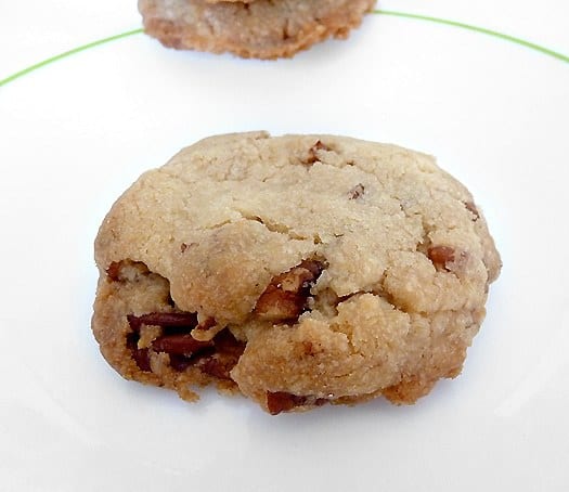 Pecan sandies cookies on a white plate.