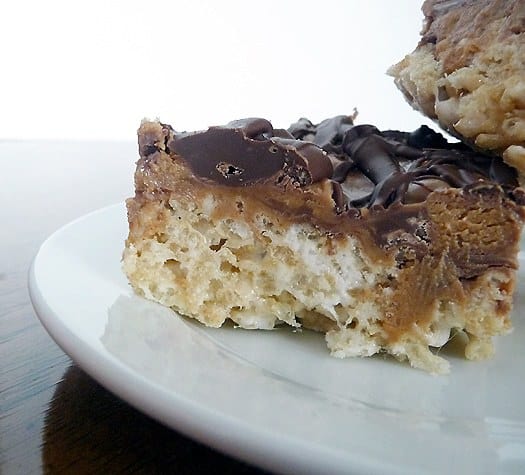 Close up image of a peanut butter Rice Krispies treat on a white plate.