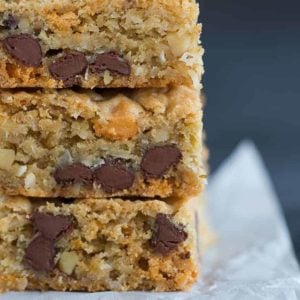 A big stack of chewy, chunky blondies with chocolate chips, butterscotch chips, walnuts and coconut.