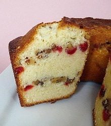 Side view of Russian pound cake with a slice removed showing the inside texture and layers.