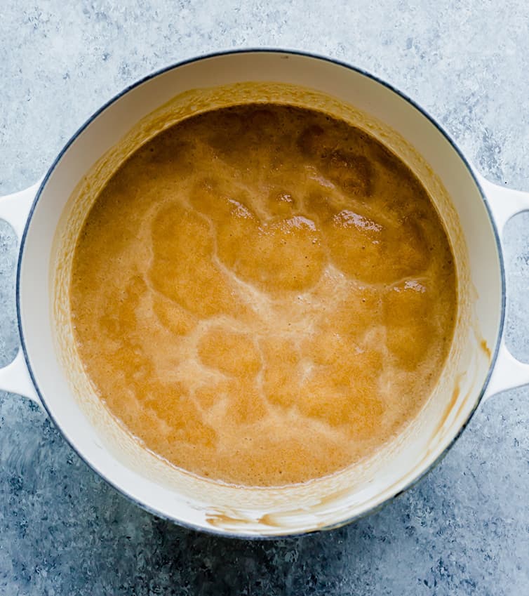 A pot with boiling butter and peanut butter for peanut butter fudge.