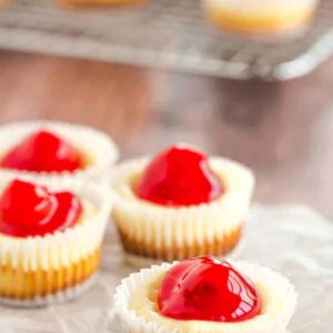 These easy mini cheesecakes have been a holiday staple in my family forever! Nilla wafers are topped with cheesecake batter and cherry pie filling. A perfect bite-size treat!