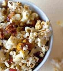 Maple bacon kettle popcorn in a white bowl.