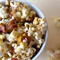 Maple bacon kettle popcorn in a white bowl.