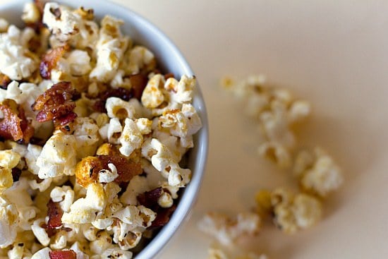 Overhead image of maple bacon kettle popcorn in a white bowl.