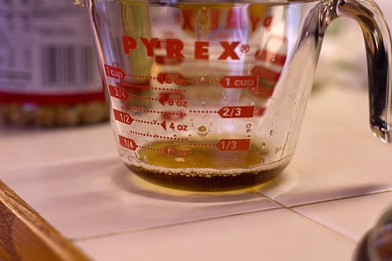 Bacon grease in a glass measuring cup.