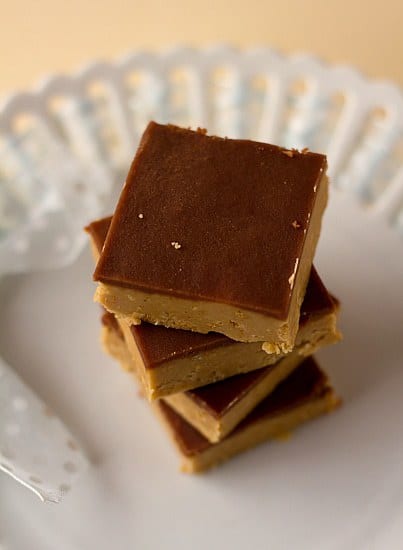 Overhead image of a stack of peanut butter cup bars on a white plate.