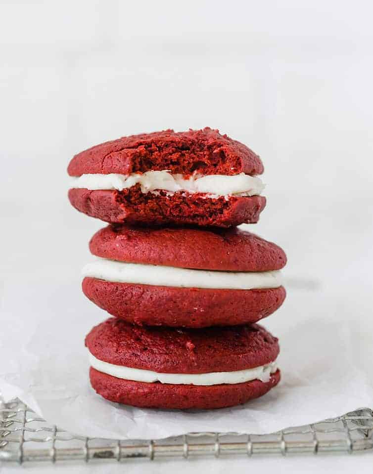 A stack of three red velvet whoopie pies.