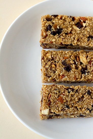 Overhead image of 3 homemade granola bars on a white plate.