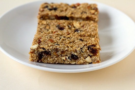 Homemade granola bars on a white plate.