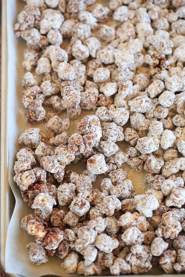 This popcorn version of the enormously popular muddy buddies (or "puppy chow") is chocolate and peanut butter-covered popcorn tossed in powdered sugar. | browneyedbaker.com