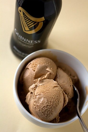 Scoops of Guinness milk chocolate ice cream in a white bowl with a spoon.