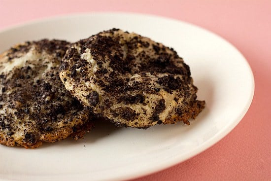 2 Oreo cheesecake cookies on a white plate.