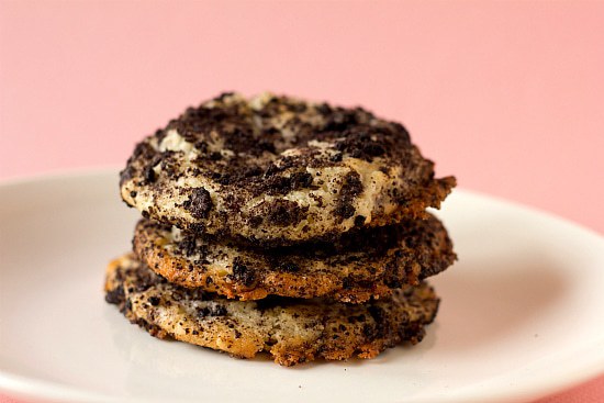 Stack of 3 Oreo cheesecake cookies on a white plate.